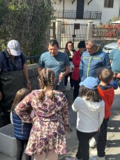 Team Leader of Rewilding Apennines Mario Cipollone introduces to local children in Morino the juvenile trout release that it is going to happen in the Romito River, one of the Liri tributaries.
