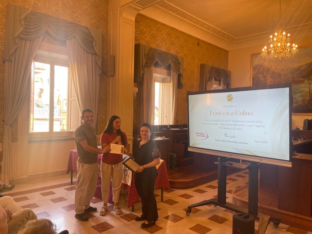 Francesca Gulino, who came third in the competition, receives her prize plaque.